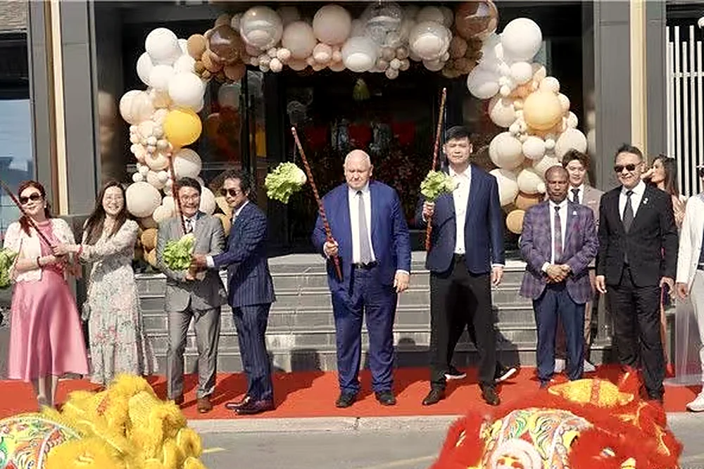 Guests cutting the ribbon at Luna Private Banquets